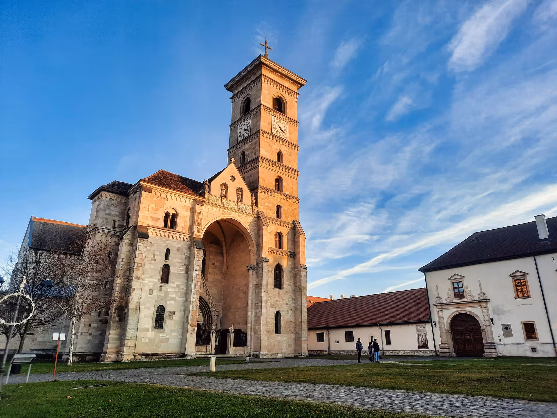 Romanesque Saint Michael Cathedral in Alba Iulia glowing at sunset on a Transylvania guided tour