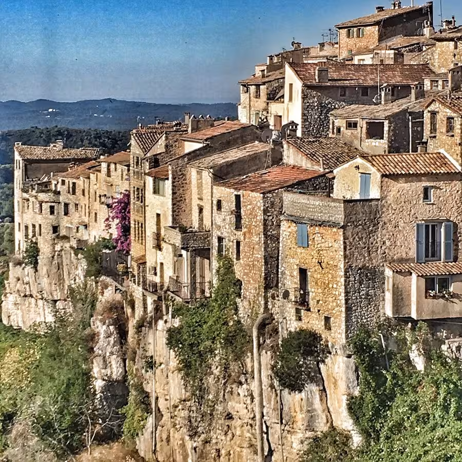 Medieval stone buildings perched on dramatic cliffs in Saint-Paul-de-Vence, Provence, France