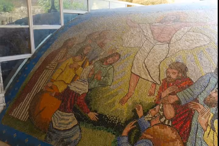 Colorful biblical mosaic artwork at Saint Simon Cave Church in Cairo, featured on Old Cairo churches tour