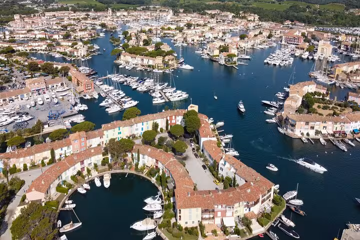 Aerial view of Port Grimaud marina near Saint-Tropez with colorful buildings and moored yachts