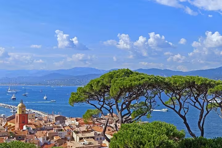 Panoramic view of Saint-Tropez harbor with sailboats and terracotta rooftops on a Golden Coast day trip