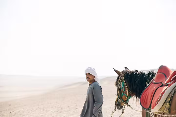 Local guide with saddled horse in the desert on Sakkara, Memphis and Dahshur private tour with transfers