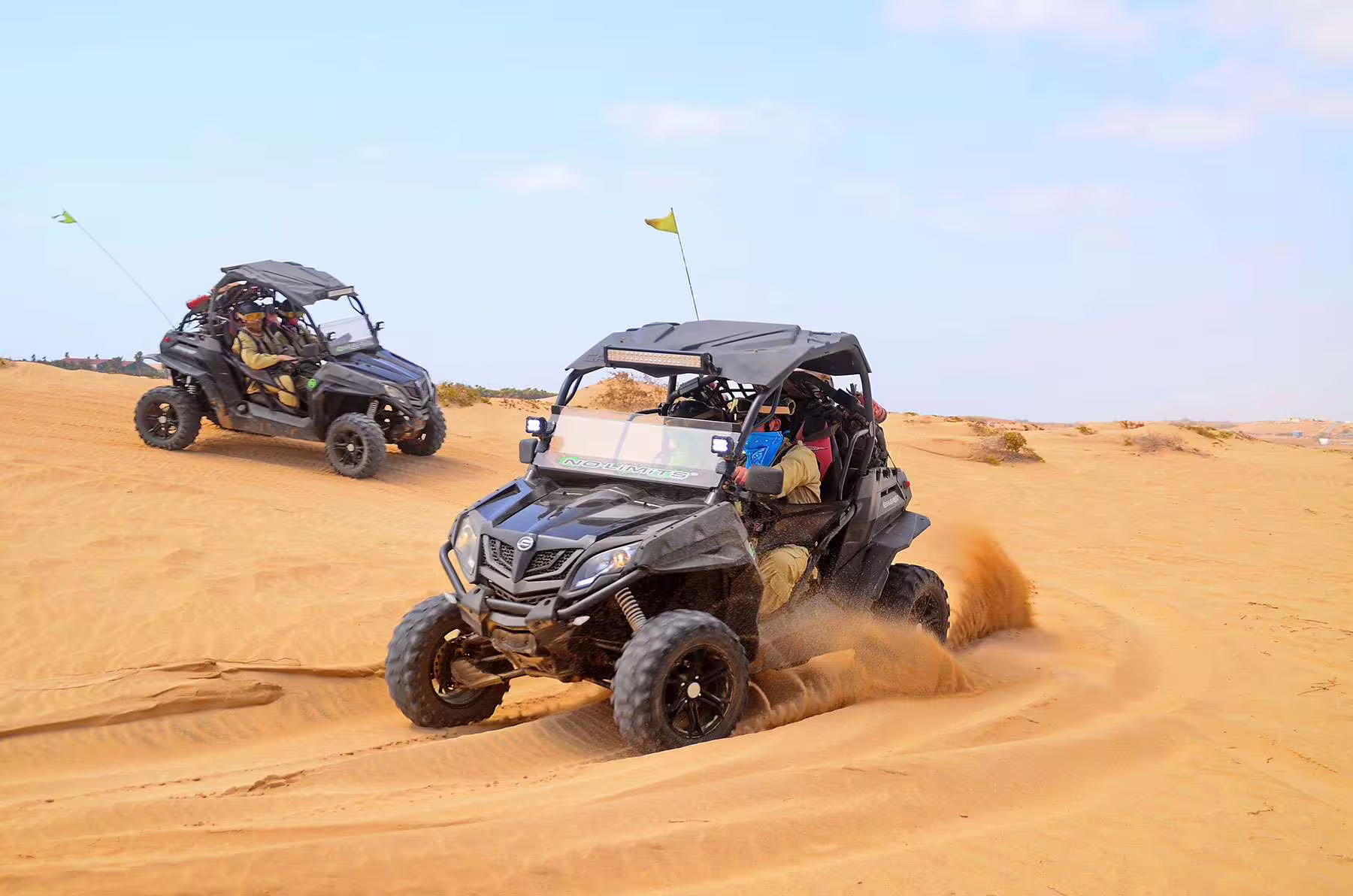 Exciting buggy adventure on Sal Island's sandy dunes, showcasing the thrill of off-road desert exploration.