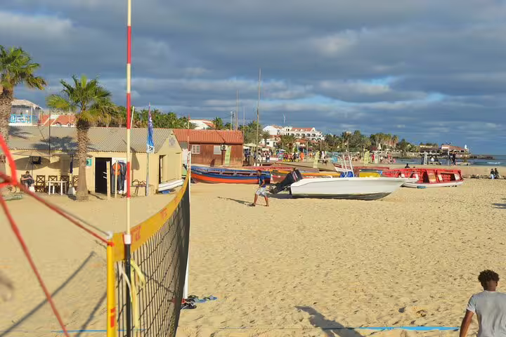 Murdeira beach on Sal Island with boats and sand, ideal stop after private airport transfer in Cape Verde