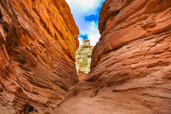 Narrow Salama Canyon corridor with towering rock walls, featured on Sharm El Sheikh to Dahab Jeep safari tour