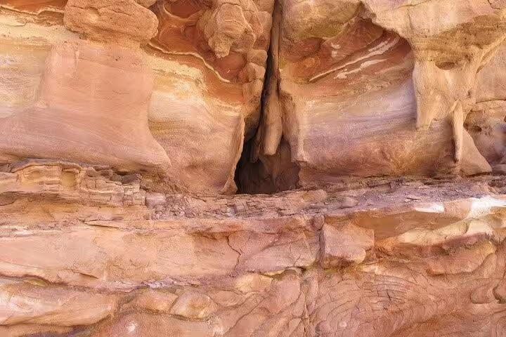 Rock wall with narrow canyon split in Salama Canyon, visited on Jeep safari from Sharm el Sheikh to Dahab
