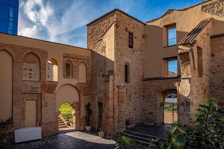 Charming stone courtyard in Salamanca, showcasing historic architecture and inviting pathways for a city tour.