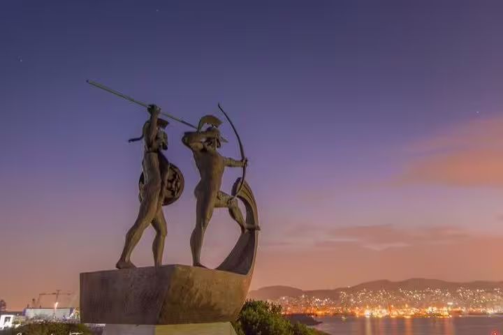 Sunset view of Salamis naval monument statue overlooking the sea, highlight of Salamina Island private day tour