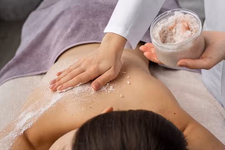Salt scrub treatment on back in Luxor hammam spa, included in 2-hour Turkish bath relaxation and massage experience