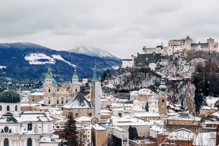 Snowy Salzburg old town skyline with Hohensalzburg Fortress, Austria, on private day trip from Vienna