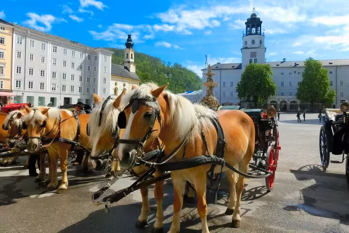 Horse-drawn carriage in Salzburg Residenzplatz with Old Town views on a small-group day trip from Vienna