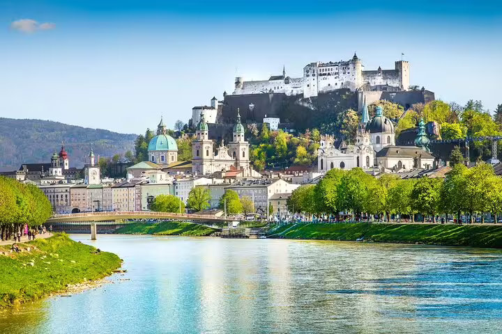 Salzburg Old Town skyline with Hohensalzburg Fortress above the Salzach River on a sunny day