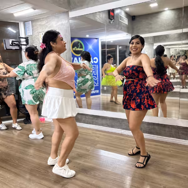 Women engage in an energetic samba class, showcasing vibrant dance moves suitable for beginners to pros.