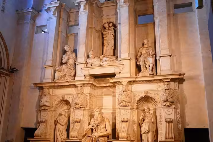 Impressive marble altar with detailed sculptures in San Clemente, a highlight of the Underground Rome tour experience.