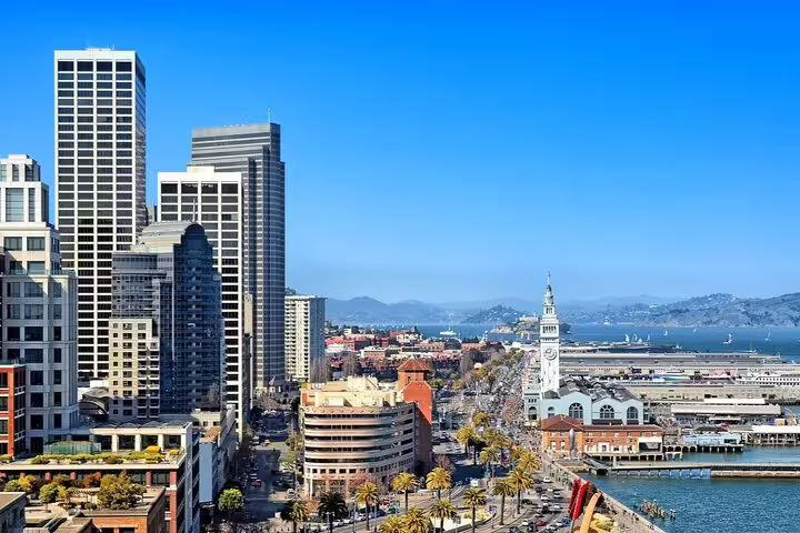 Aerial view of San Francisco waterfront with Ferry Building clock tower and downtown skyline