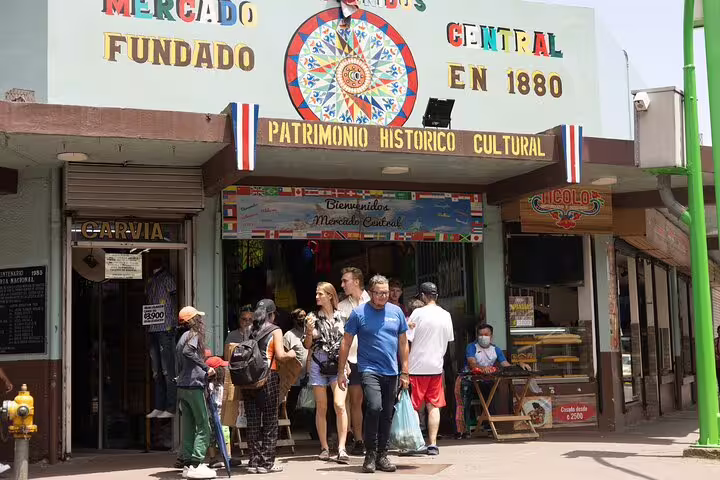 People explore the historic Mercado Central, a key stop on the San Jose walking food tour.