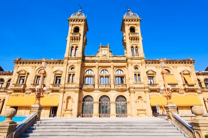 San Sebastian City Hall neoclassical facade with twin towers and grand staircase on a sunny day