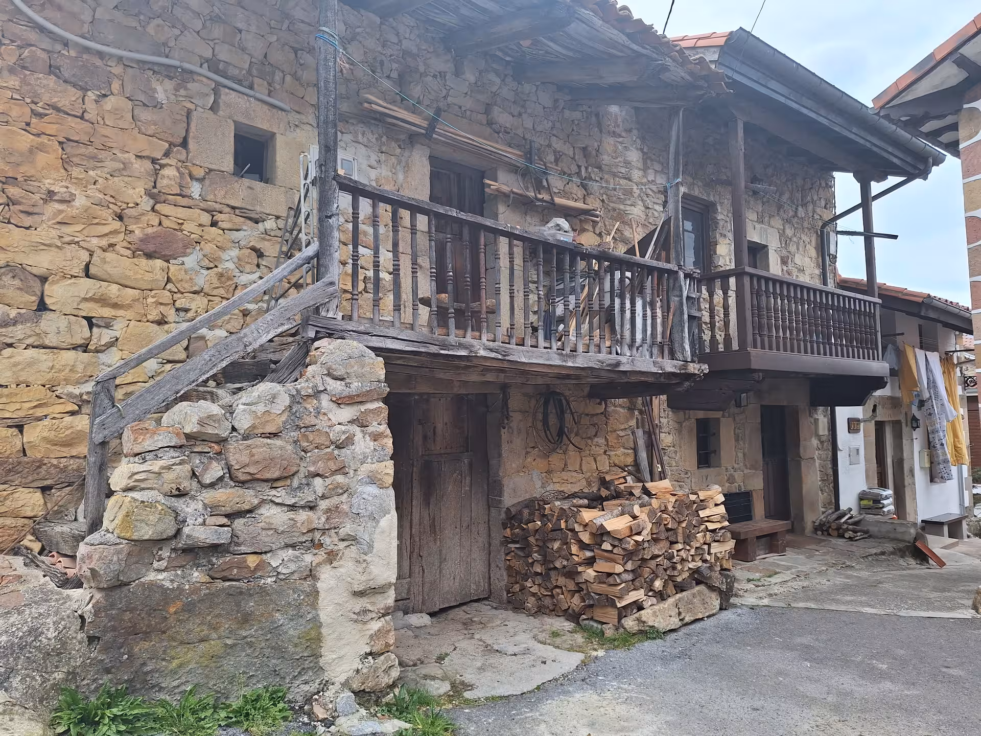 Charming rustic stone house with wooden balcony in the village of San Sebastian De Garabandal.