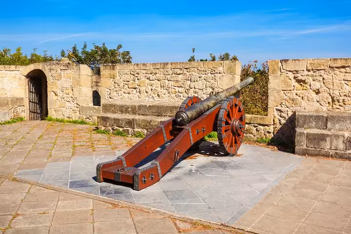 Historic cannon at San Sebastian's hilltop fort, showcasing rich heritage on a private 2-hour city walk tour.