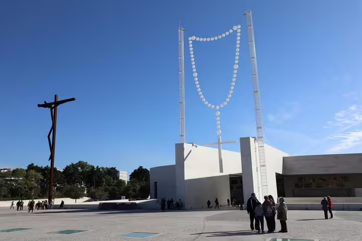 Modern architecture and visitors at the Sanctuary of Fátima, a key stop on the private Lisbon and Fátima full-day tour.