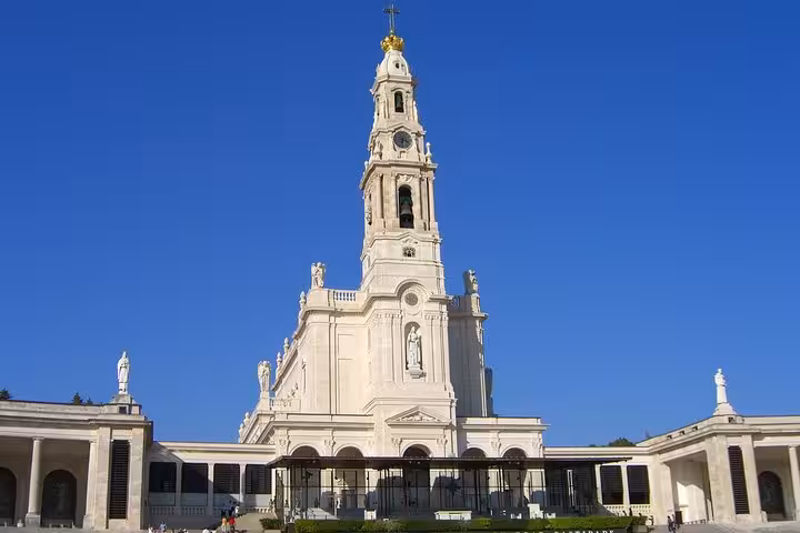 Majestic view of the Sanctuary of Fátima, a renowned pilgrimage site with stunning architecture in Portugal.