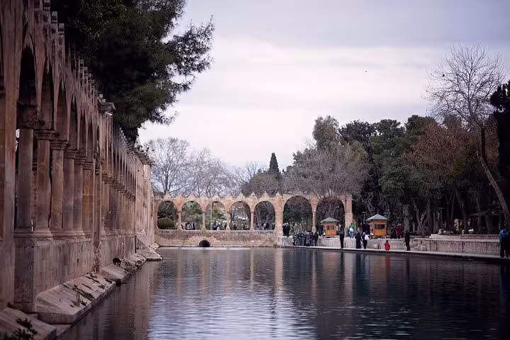Historic stone arches and reflecting pool at Şanlıurfa Balıklıgöl on a private guided Mesopotamia tour