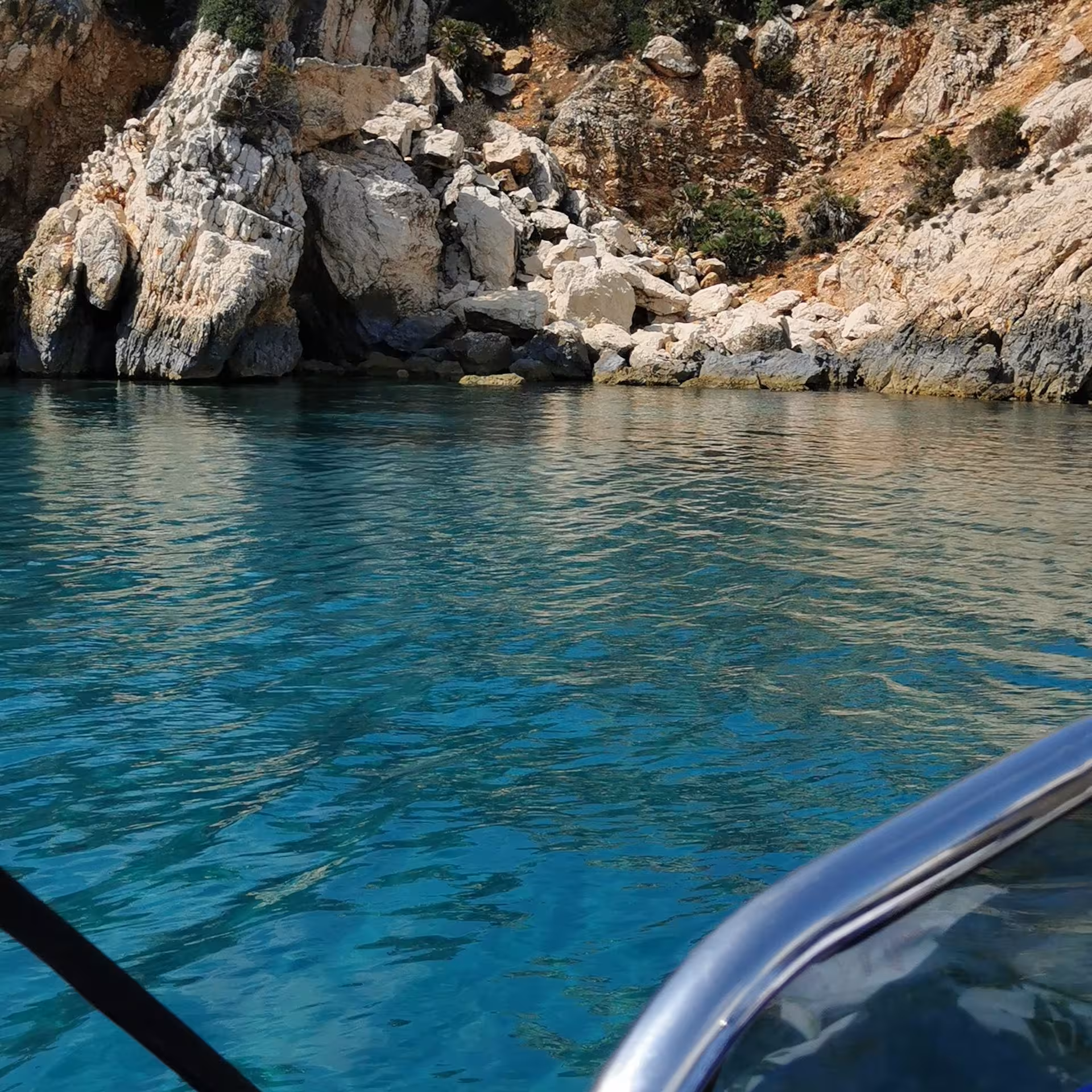 Explore Sant'Antioco's stunning rocky coastline and clear blue waters on a 4-hour RIB tour adventure.