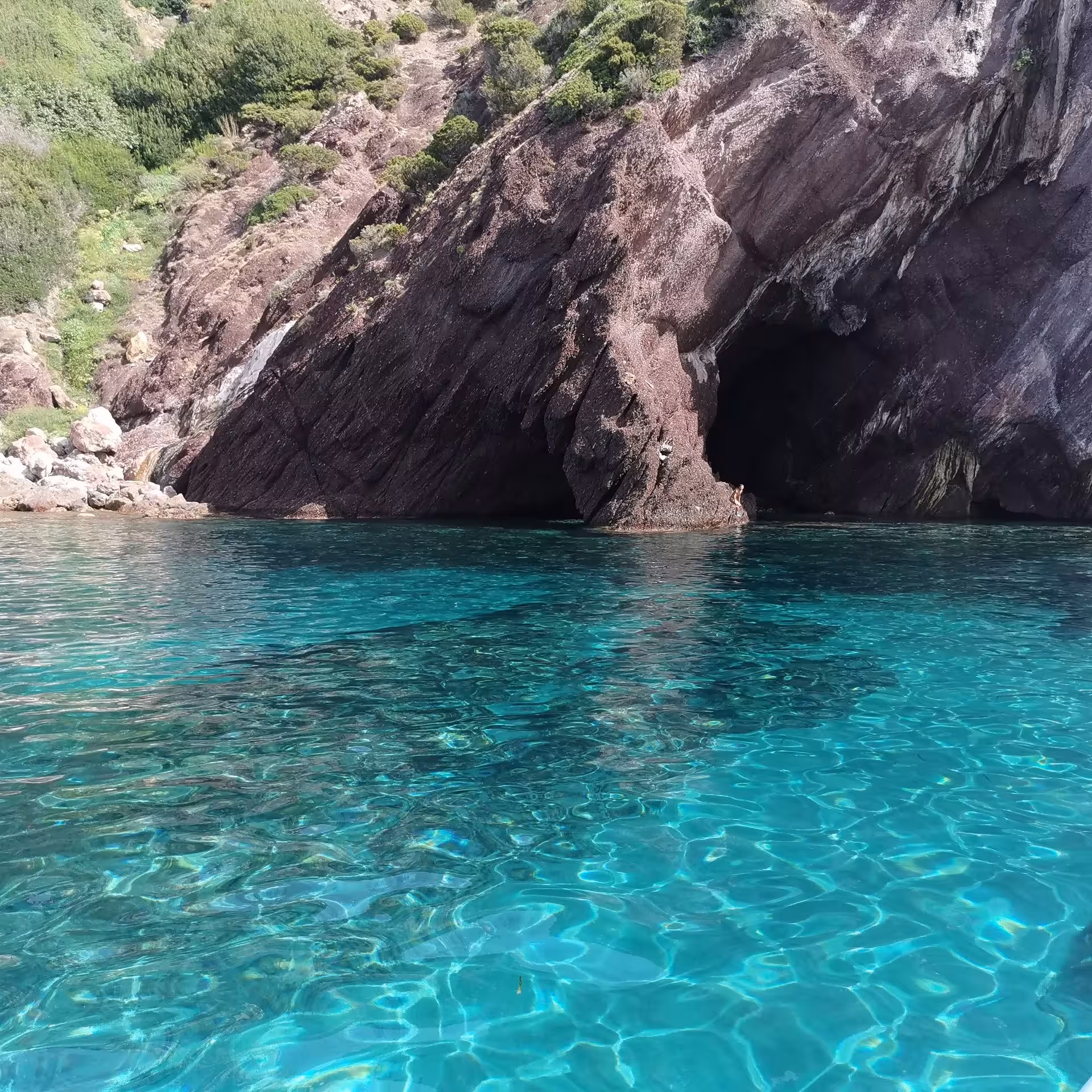 Explore Sant'Antioco's stunning turquoise waters and dramatic cliffs on a 4-hour RIB tour adventure.