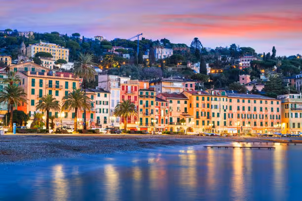 Scenic view of Santa Margherita Ligure's colorful waterfront buildings at sunset, perfect for a Ligurian Riviera food tour.