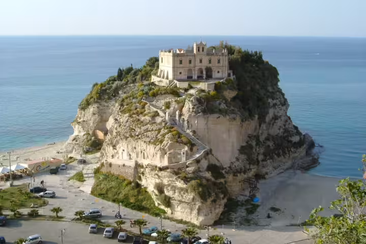 Sanctuary of Santa Maria dell’Isola perched on a rocky cliff above the turquoise Tyrrhenian Sea in Tropea, Calabria