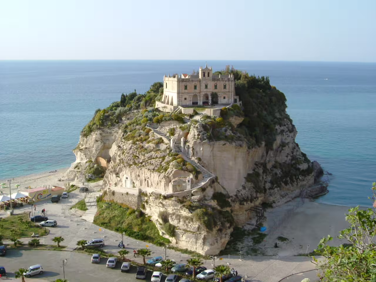Sanctuary of Santa Maria dell’Isola on a rocky promontory above Tropea’s turquoise sea, featured on the Mediterranean Passion tour
