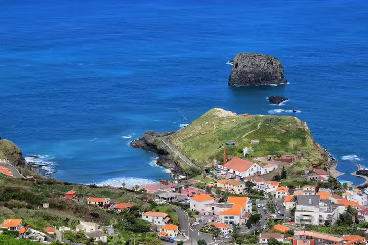 Aerial view of Santana's coastal village with vibrant rooftops and stunning ocean backdrop, perfect for a Northeast 4x4 tour.