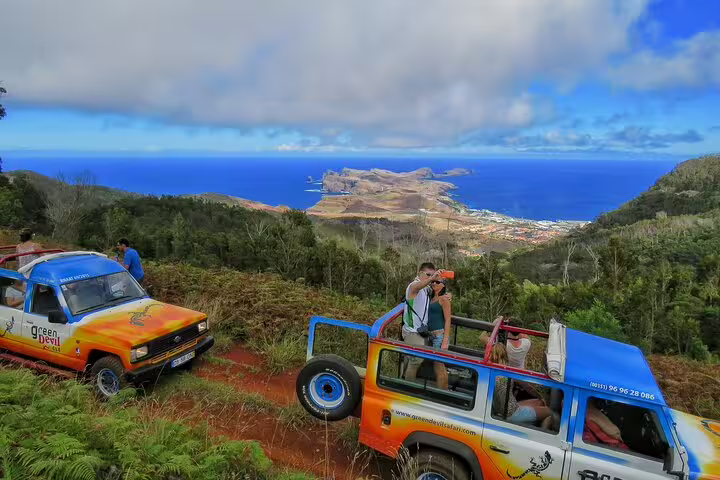 Off-road jeeps overlooking Madeira's stunning northeast coastline during the Full Day Santana Wonders 4WD Experience.