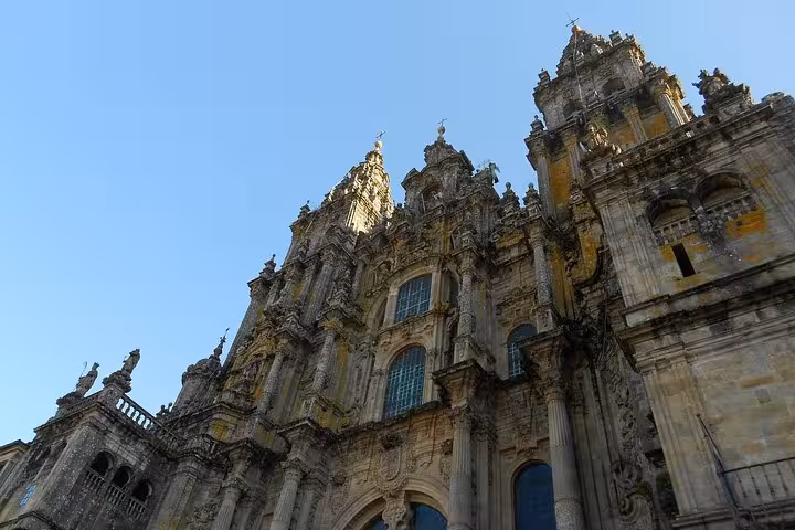 Magnificent facade of Santiago de Compostela Cathedral on a sunny day during a guided tour in northern Spain.