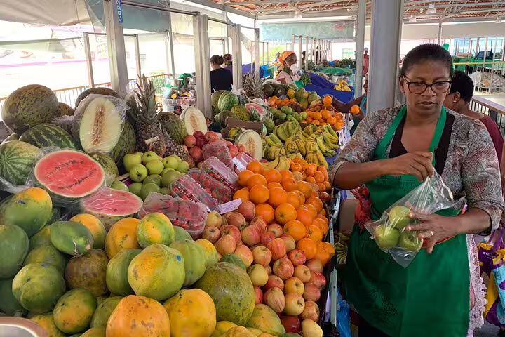 Vibrant fruit market scene with diverse produce, highlighting local flavors on Santiago Island, Cape Verde.