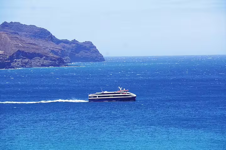 Speedboat cruising near Santiago Island coast, offering scenic views on the way to Praia's hotels from the port.