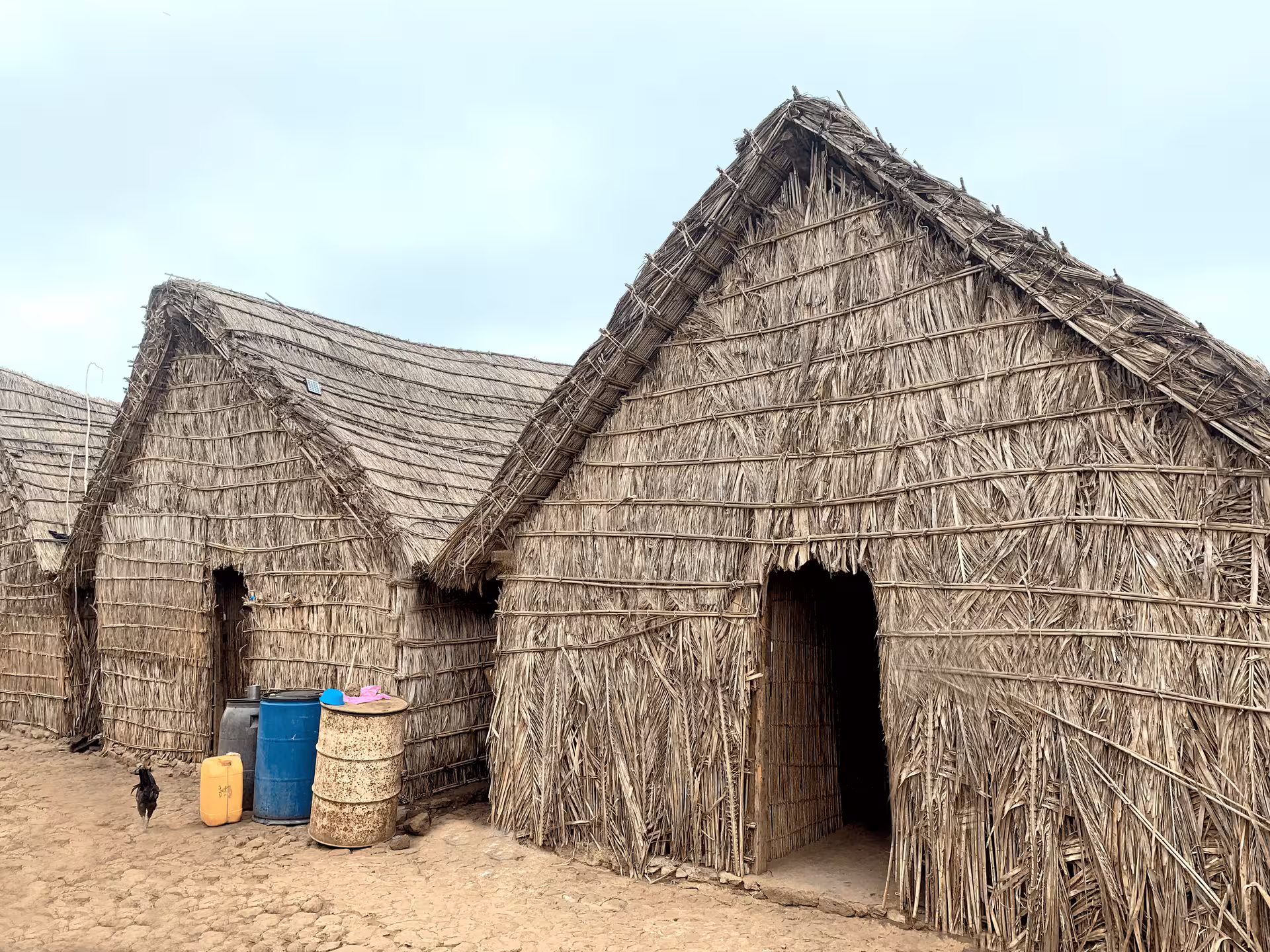 Traditional straw huts in rural Santiago Island village, cultural stop on Best of Santiago tour from Praia