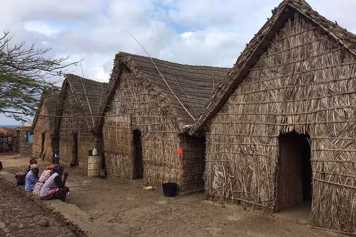 Traditional thatched huts in a rural village on Santiago Island, Cape Verde, showcasing local architecture and culture.