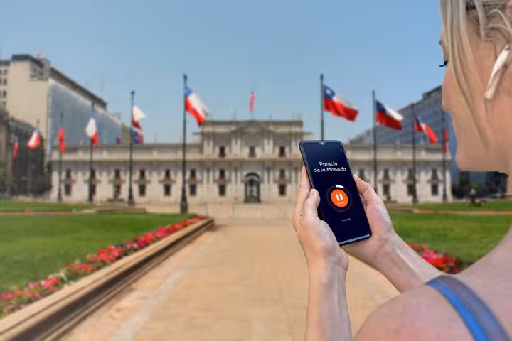 Tourist using GPS audio guide app at Palacio de la Moneda in Santiago, Chile