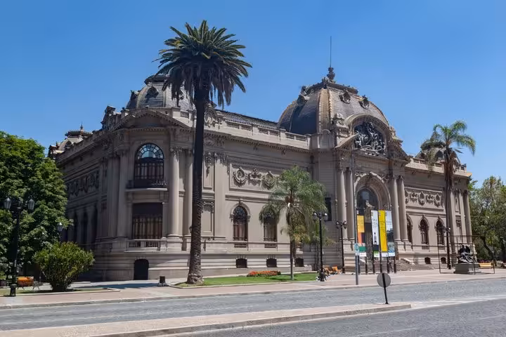 Ornate Beaux-Arts facade of the Museum of Fine Arts in Santiago, Chile, surrounded by palm trees