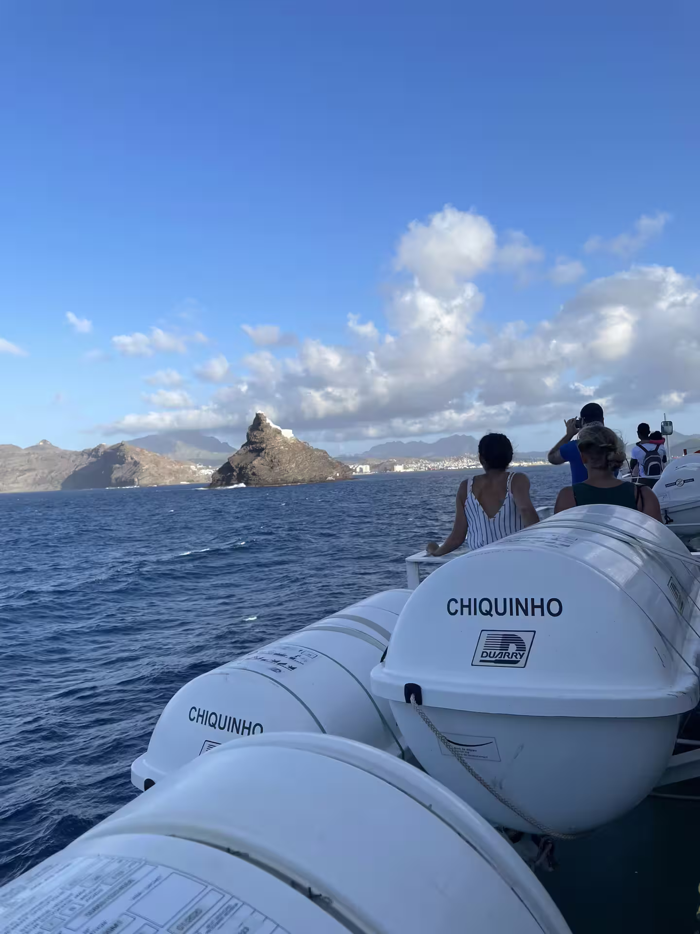 Travelers on a ferry from São Vicente to Santo Antão enjoy stunning ocean views, perfect for an 11-hour island highlights tour.