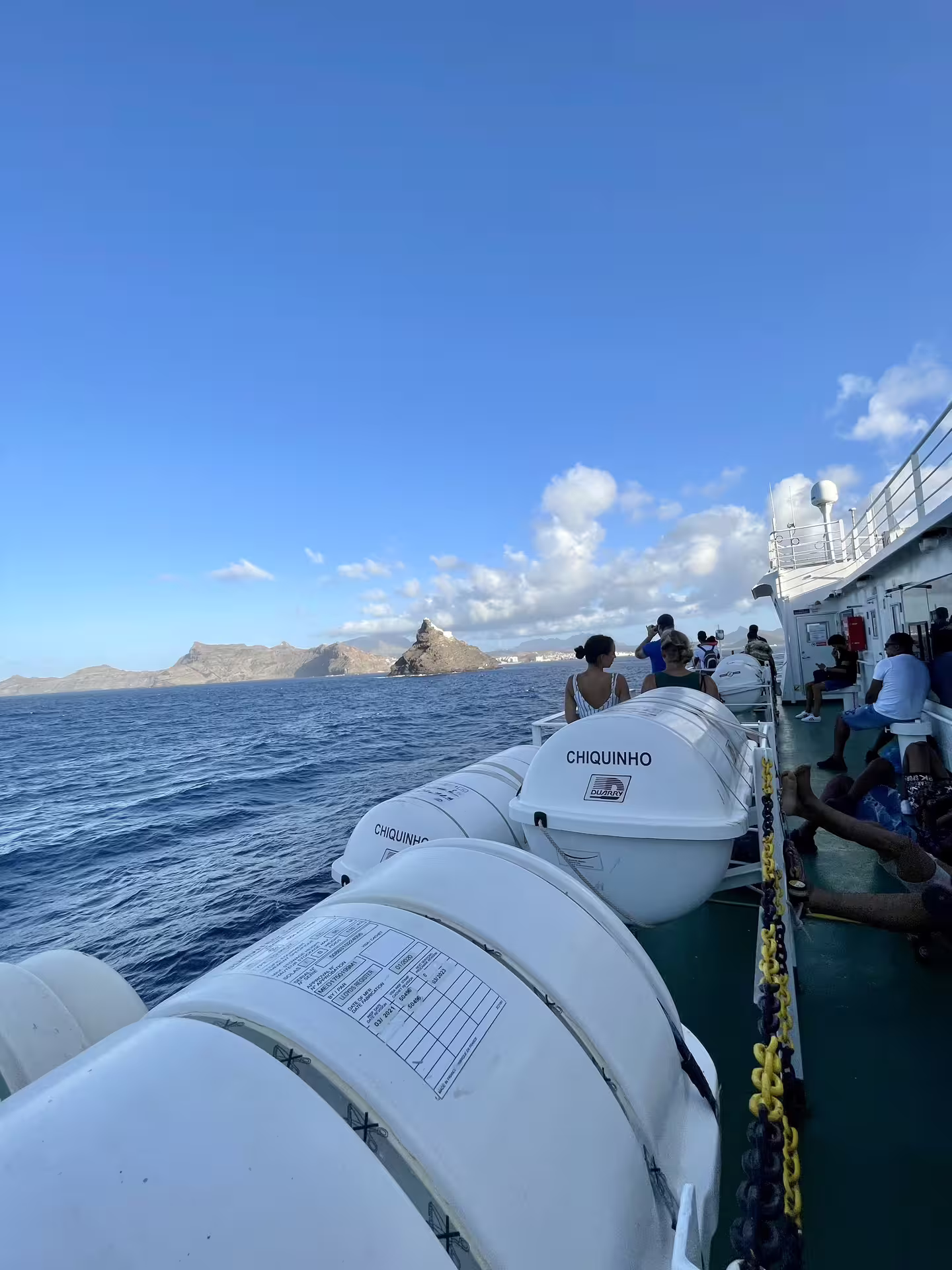 Passengers enjoy scenic ocean views aboard a ferry from São Vicente en route to Santo Antão's Valley of Paul trek.