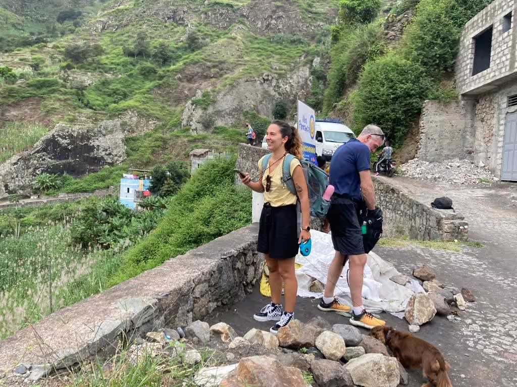 Travelers exploring the lush landscapes of Santo Antão's Valley of Paul, highlighting the vibrant greenery and rustic charm.