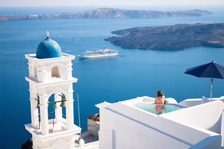 Blue-domed church and caldera cruise view in Fira, Santorini highlights 3-day private tour from Athens