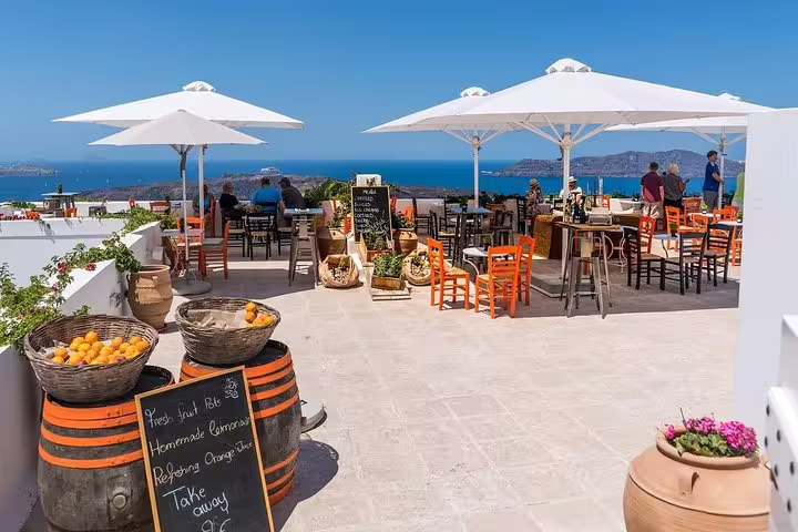 Ocean-view terrace cafe in Santorini, ideal stop on a private 2-hour sightseeing tour with caldera views