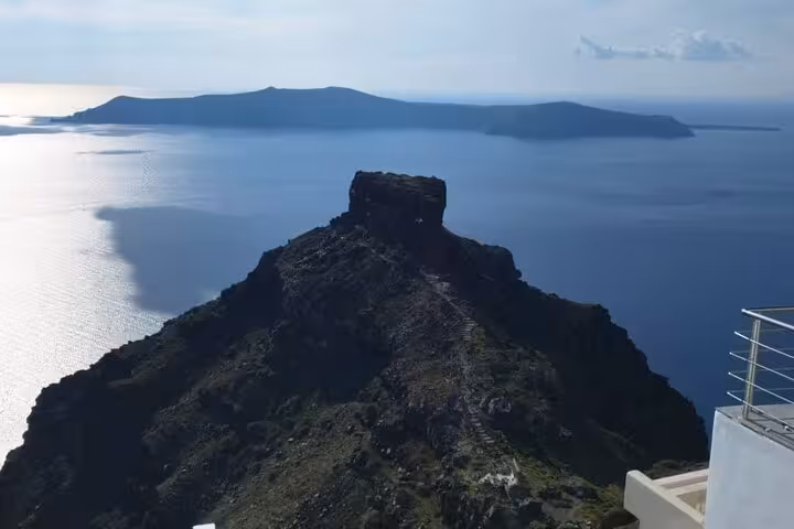 Caldera viewpoint over Skaros Rock and the Aegean Sea, scenic stop on Santorini iconic highlights tour