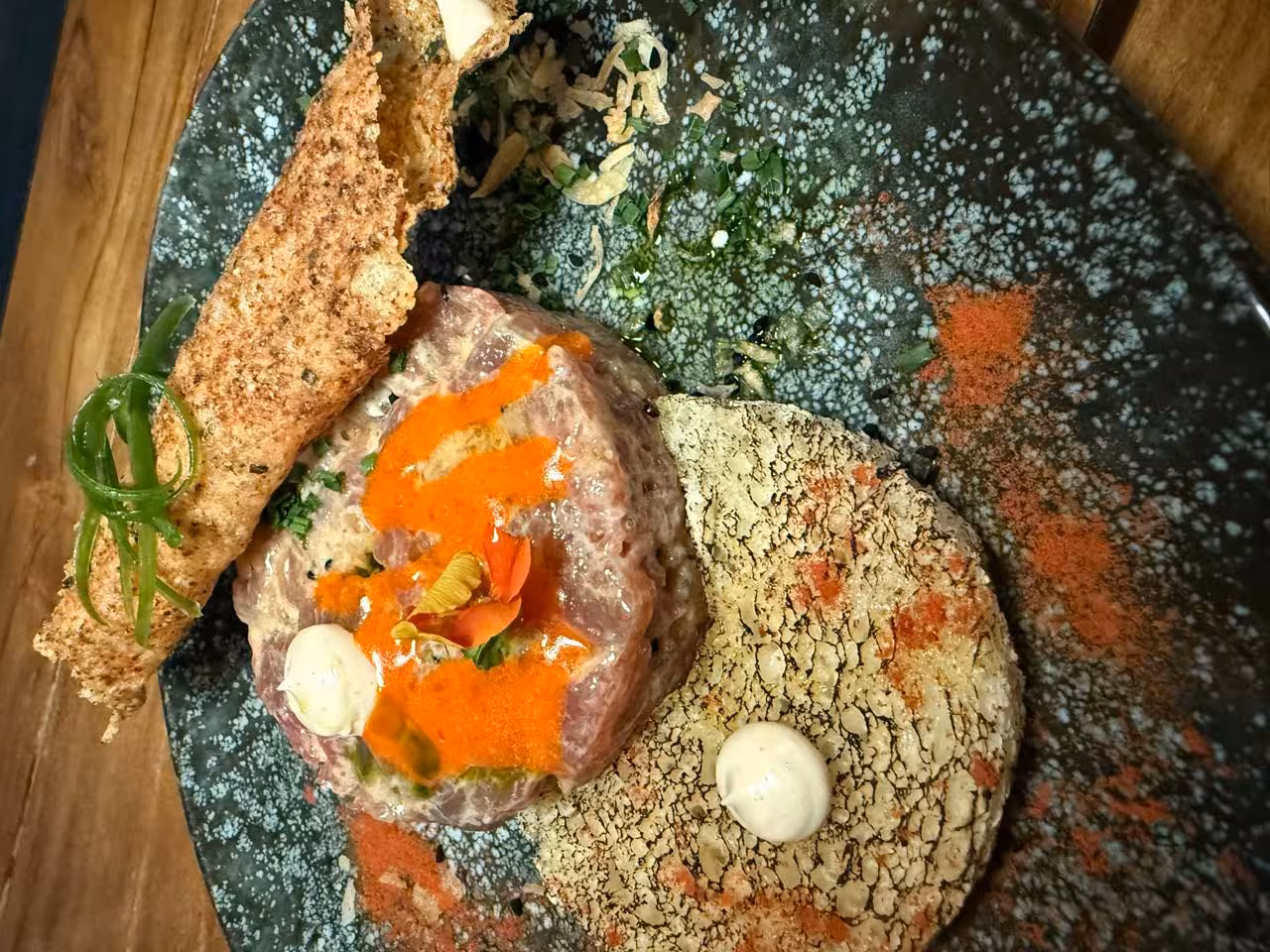 Gourmet Santorini dinner course at Santo Winery, artfully plated tasting dish for a caldera-view wine experience