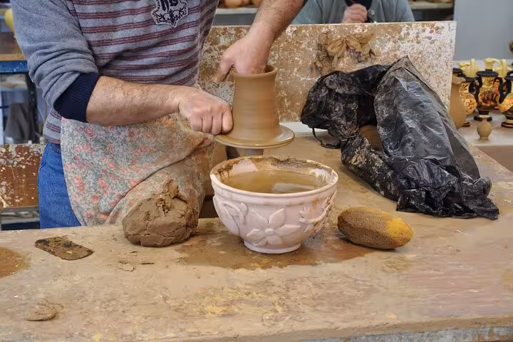 Hands-on pottery workshop in a Santorini village, cultural stop on the Five Senses wine tour for cruise guests