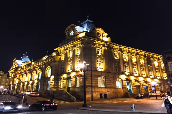 Illuminated São Bento Station at night in Porto, showcasing stunning architecture on a private tour of iconic attractions.