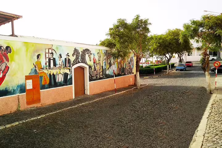 Vibrant mural on a street in São Filipe, showcasing Cape Verdean culture, part of the Fogo Volcano guided tour.